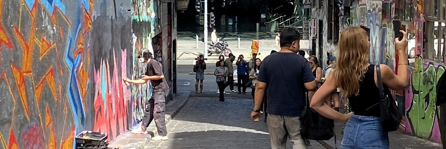 Photo looking down Hosier Lane in Melbourne towards Federation Square