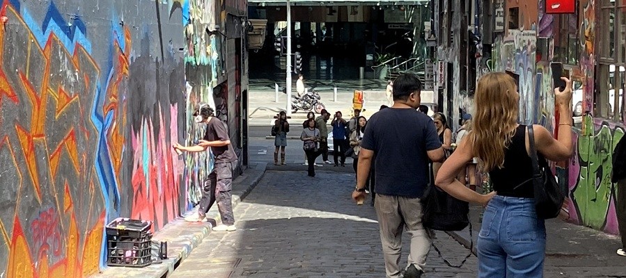 Photo looking down Hosier Lane in Melbourne towards Federation Square