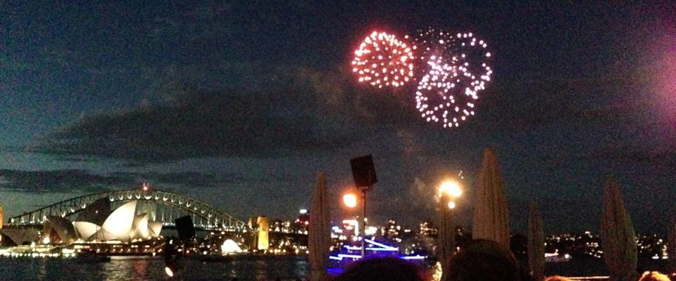 Photo of fireworks over Sydney Harbour, with Sydney Harbour Bridge and Sydney Opera House in the background