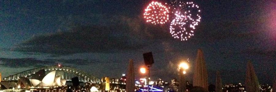 Photo of fireworks over Sydney Harbour, with Sydney Harbour Bridge and Sydney Opera House in the background